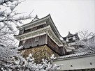 雪降る福知山城…