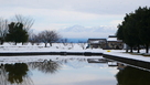 南側水堀と雪の剣岳…