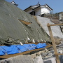 震災で崩れ、修復中の本丸南面石垣
